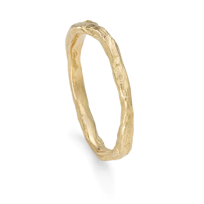 Organic irregular gold band with engraved texture 