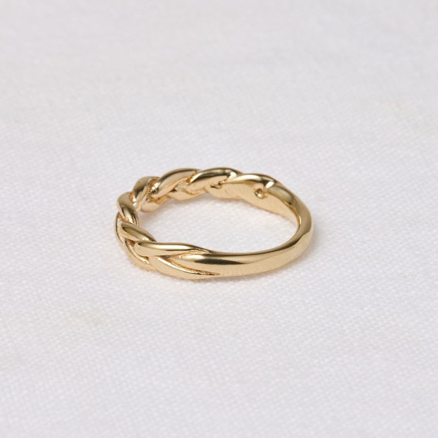 this ring features a soft, braided motif across the top on model - Marisa Mason Jewelry