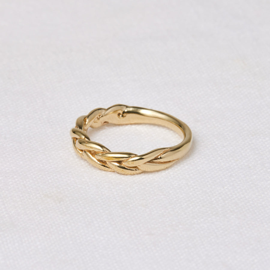 this ring features a soft, braided motif across the top on model - Marisa Mason Jewelry