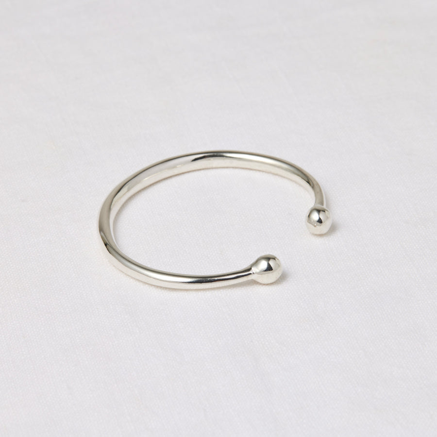 Simple round silver cuff with rounded balls at the opening - Marisa Mason Jewelry