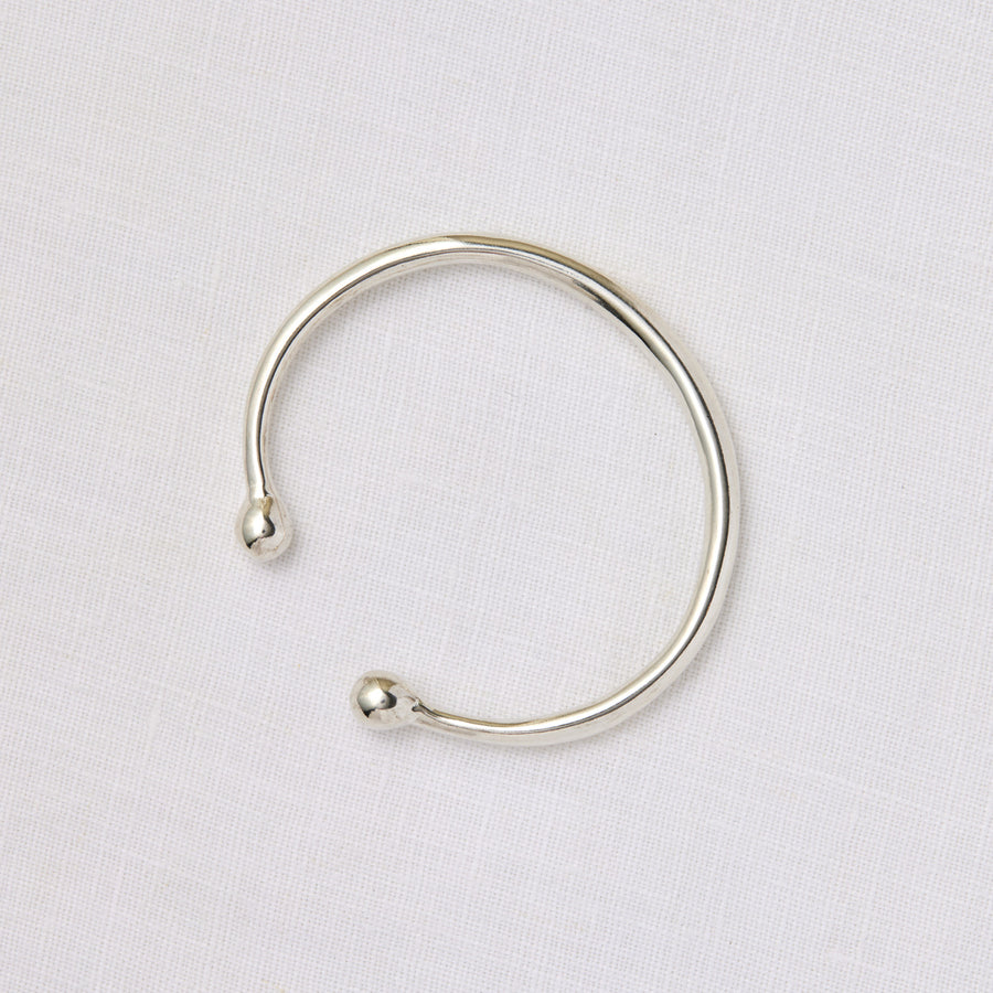 Simple round silver cuff with rounded balls at the opening - Marisa Mason Jewelry
