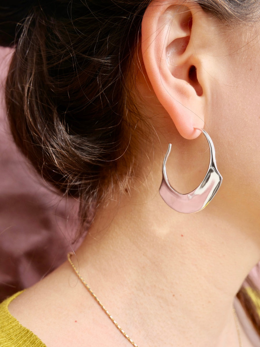 Hoops with fan detail at the bottom arch, brass with sterling silver ear wire on model-Marisa Mason