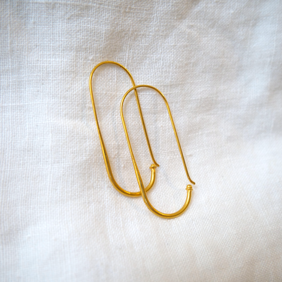 Beautiful, simple, long oval like shape hoops made of 18k yellow gold. About 1