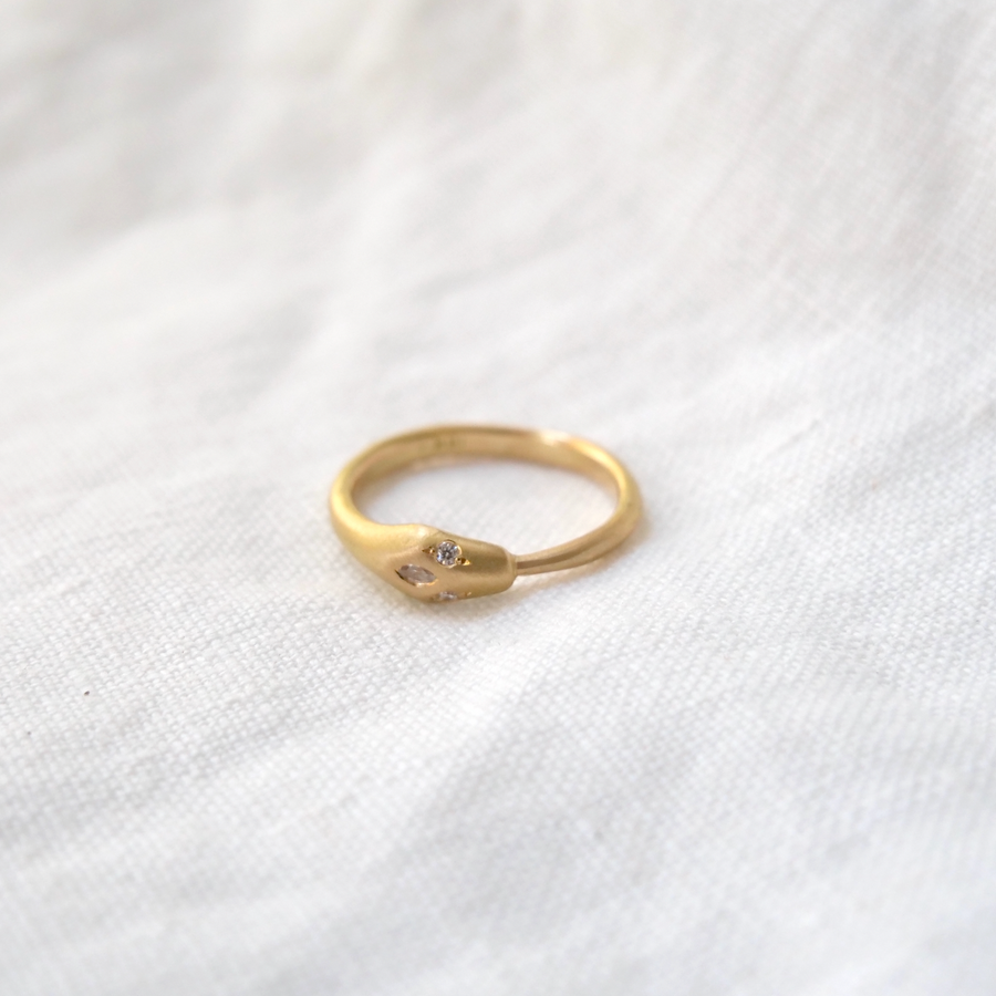 Gold band snake around finger ouroboros ring 18k gold white diamonds Marisa Mason Jewelry