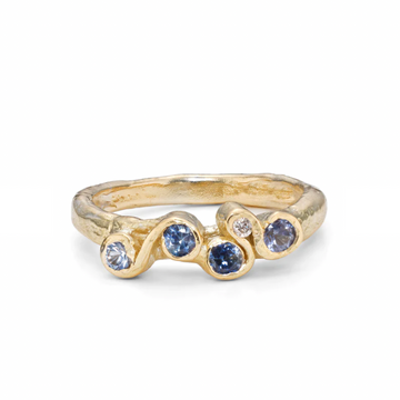 Skyline Corallina Ring 4 blue sapphires and one white diamond set in 145k swirling gold 