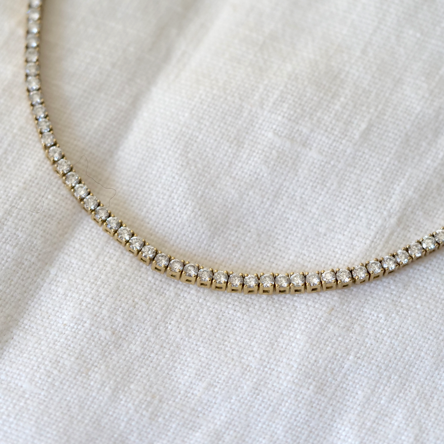 Bright white diamonds and 14k yellow gold Tennis necklace with an adjustable clasp