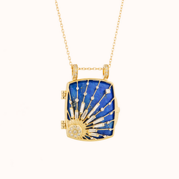 GOLD SUN AND DIAMOND BEAMS LOCKET NECKLACE WITH A MADE-TO-FIT LAPIS LAZULI NECKLACE. THE LOCKET CAN BE OPEN AND THE LAPIS REMOVED. THERE IS AN OPENING TO THE BACK OF THE LOCKET FOR THE LAPIS LAZULI TO TOUCH YOUR SKIN.