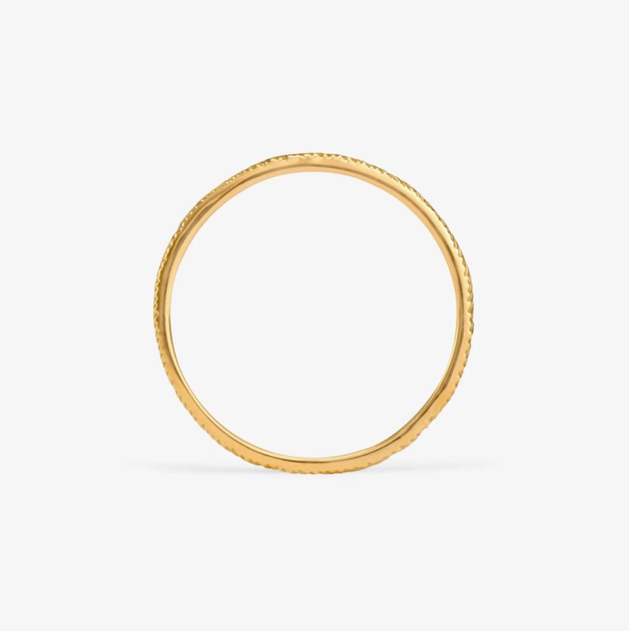 18k gold band with herringbone style etching in the surface. 