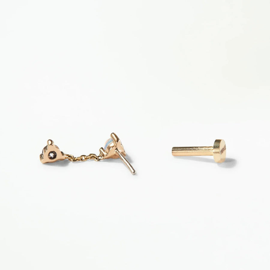 Gold earrings on a white background