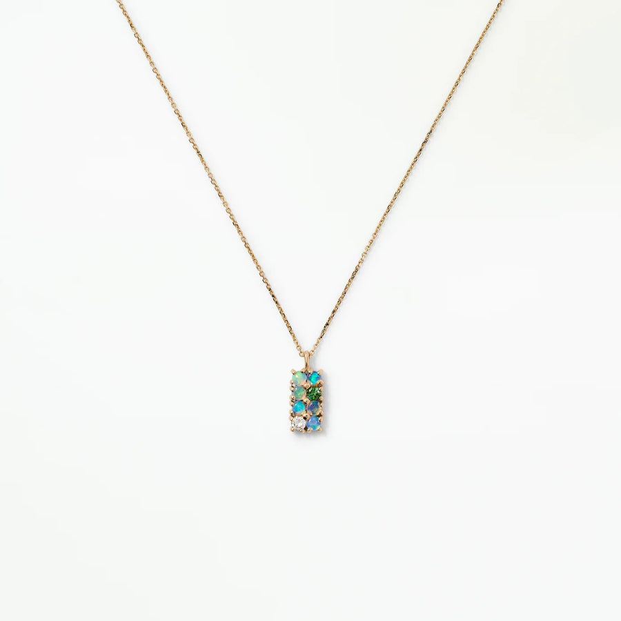 Delicate opals forming an intricate grid-like necklace with one white diamond and one tourmaline.