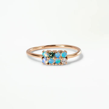 Delicate opals forming an intricate grid-like ring, with one white diamond and one green tourmaline.