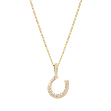 This dainty horseshoe necklace features decorative hand cuts and an inner line of white diamonds set subtly inside its curve