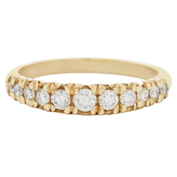 Gold ring with embedded diamonds on a white background