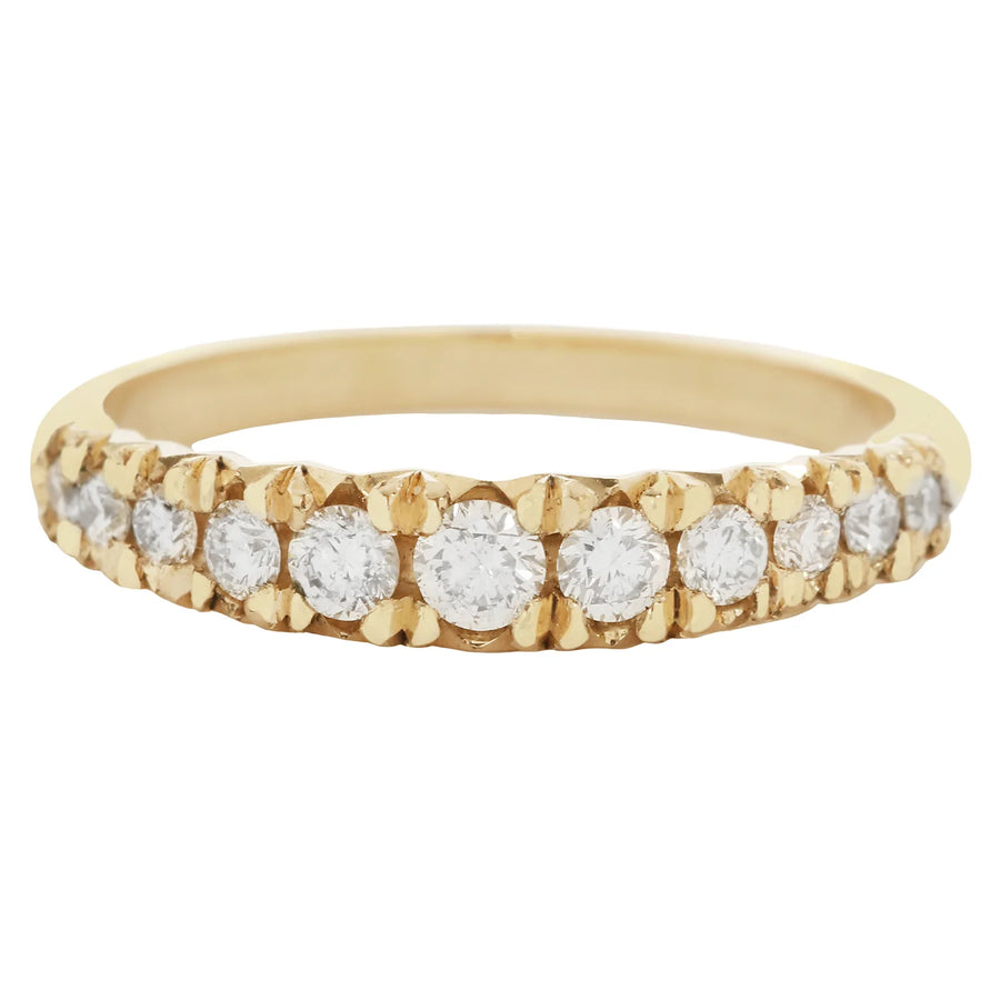 Gold ring with embedded diamonds on a white background