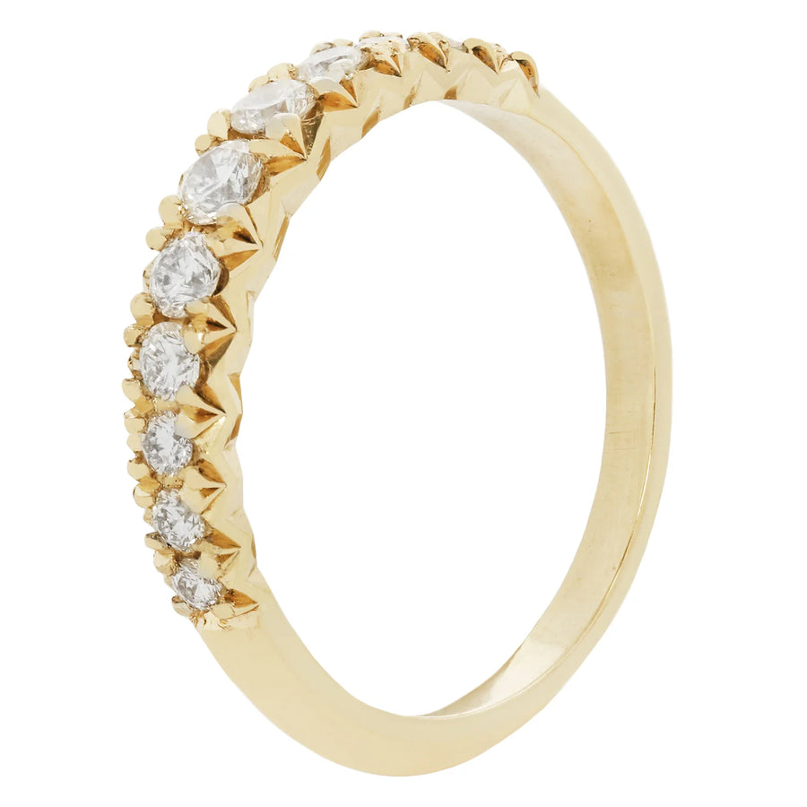 Gold ring with diamonds on a white background