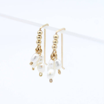 Tiny 14k gold filled beads and just as small free floating freshwater pearls make these one of our favorites