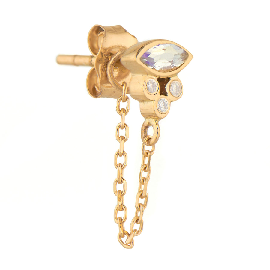gold earring with chain and moonstone and diamonds on white background
