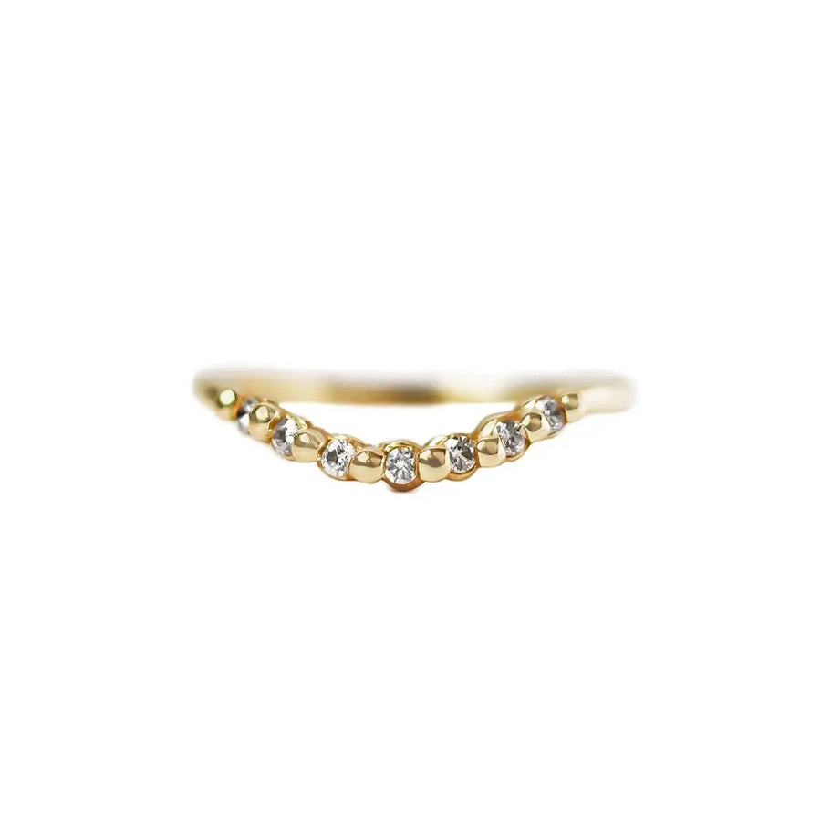 7 sparkling diamonds are set in this solid gold ring in a shared prong style setting