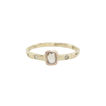 14K Yellow Gold band is married (squeezed) to a 14K Rose Gold bezel holding a 0.30 Karate Champagne rose cut cushion diamond. Sprinkled around the ring are three 1.5mm recycled diamonds, and three sediments of 14k white 