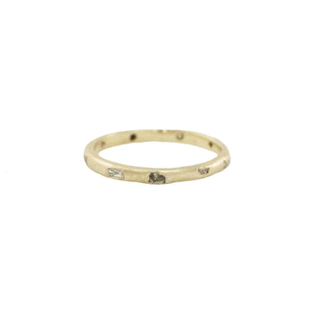 14K Yellow Gold Stacking ring sprinkled with 14k White Gold rock sediment texture and four .015 karat baguette diamonds.