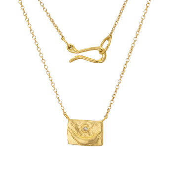 18k gold pendant with a crescent and white diamond, with a signature S hook closure