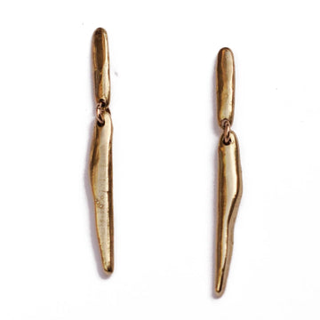 brass cylindrical earrings with hinge jump ring in the center to add movement 