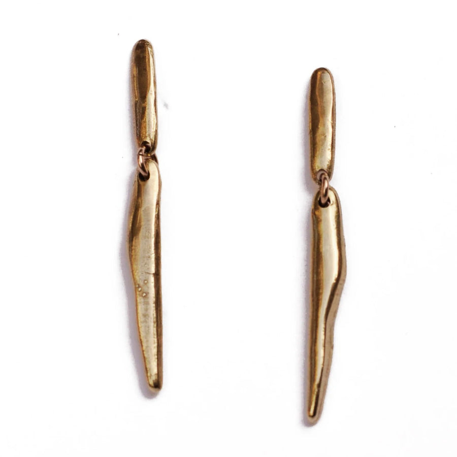 brass cylindrical earrings with hinge jump ring in the center to add movement 