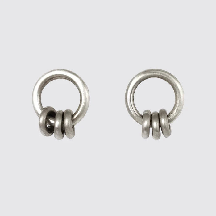 Sterling silver ring studs with moving rings. Sweet little studs that transition easily.