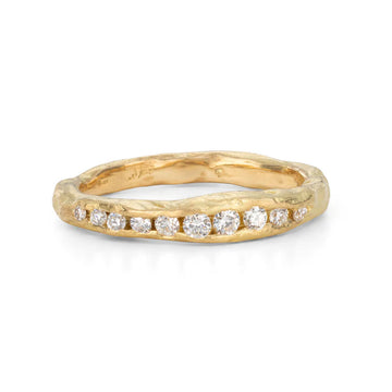 Organic gold band with ten white diamonds inset in the band