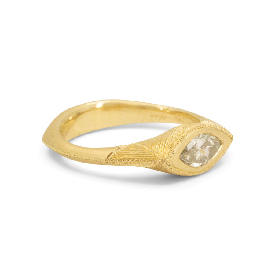 Gold ring with a diamond on a white background