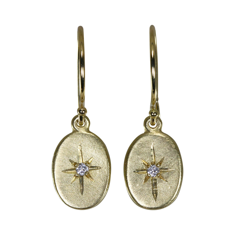 gold drop oval earrings with diamonds star set in the center 