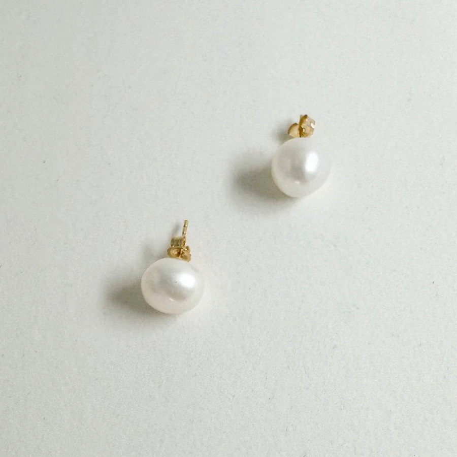 A take on the classic pearl earring, featuring a natural shape and liquid luster