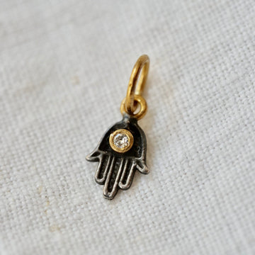 sterling silver hamsa hand with white diamond and 22k gold jumpring