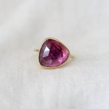 Ring with a pink gemstone on a white background