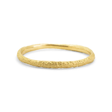 rounded 18k yellow gold band with hand engraved sand texture