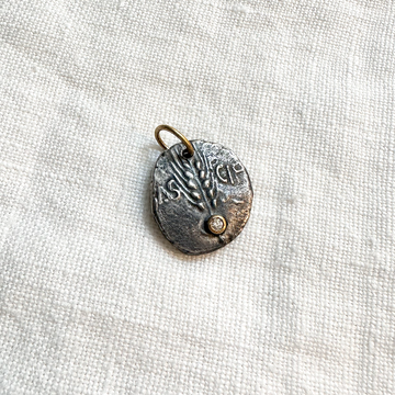 a diamond on a 16mm wheat symbol, this pendant symbolizes a bountiful harvest