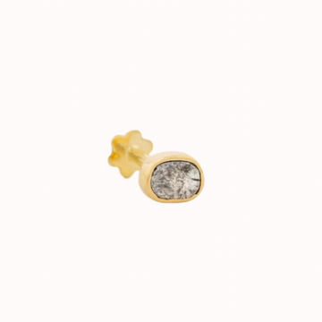 GOLD PIERCING WITH A ONE OF A KIND GREY DIAMOND . THE STONE COMES IN A GRADIENT OF WHITE AND DARK GREY