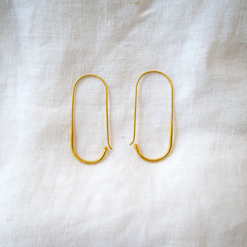 Beautiful, simple, long oval like shape hoops made of 18k yellow gold. About 1