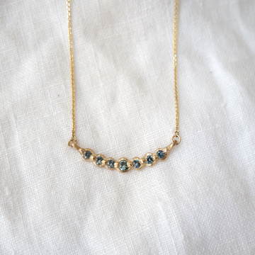 seven Montana Sapphires set in 14k gold arc pendant Marisa Mason Jewelry