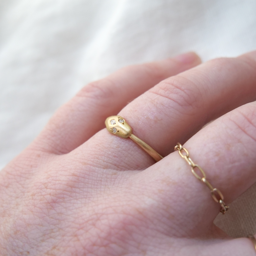 Gold band snake around finger ouroboros ring 18k gold white diamonds Marisa Mason Jewelry