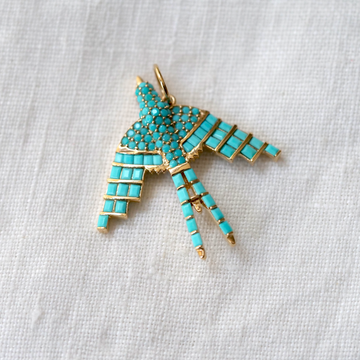 A large, intricate statement -- 14k yellow gold bird with baguette and cabochon cut turquoise