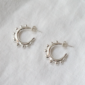 silver hoops with ear-post and nut, with ball details on the face of the hoop, solid silver