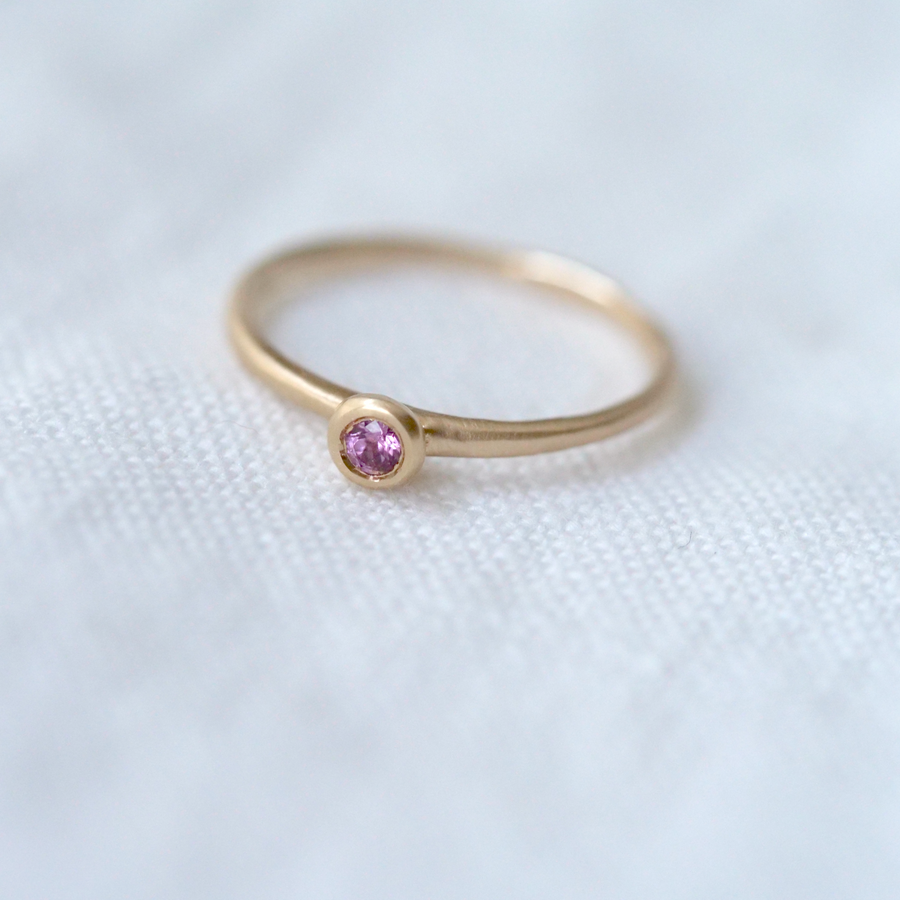 A lightweight gold band with a gorgeous 2.5mm rose cut pink garnet Marisa Mason Jewelry 