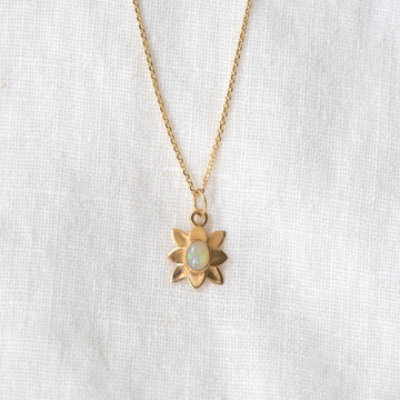 Beautiful Ethiopian opal set in 18k gold to create an eight petal flower. 