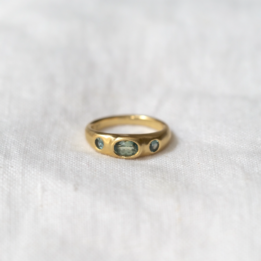 The Sempre is a delicate and sculptural take on the classic three stone ring worn through the ages.  With soft edges and stones flush set, this ring can be worn comfortably everyday and will easily withstand an active lifestyle.  