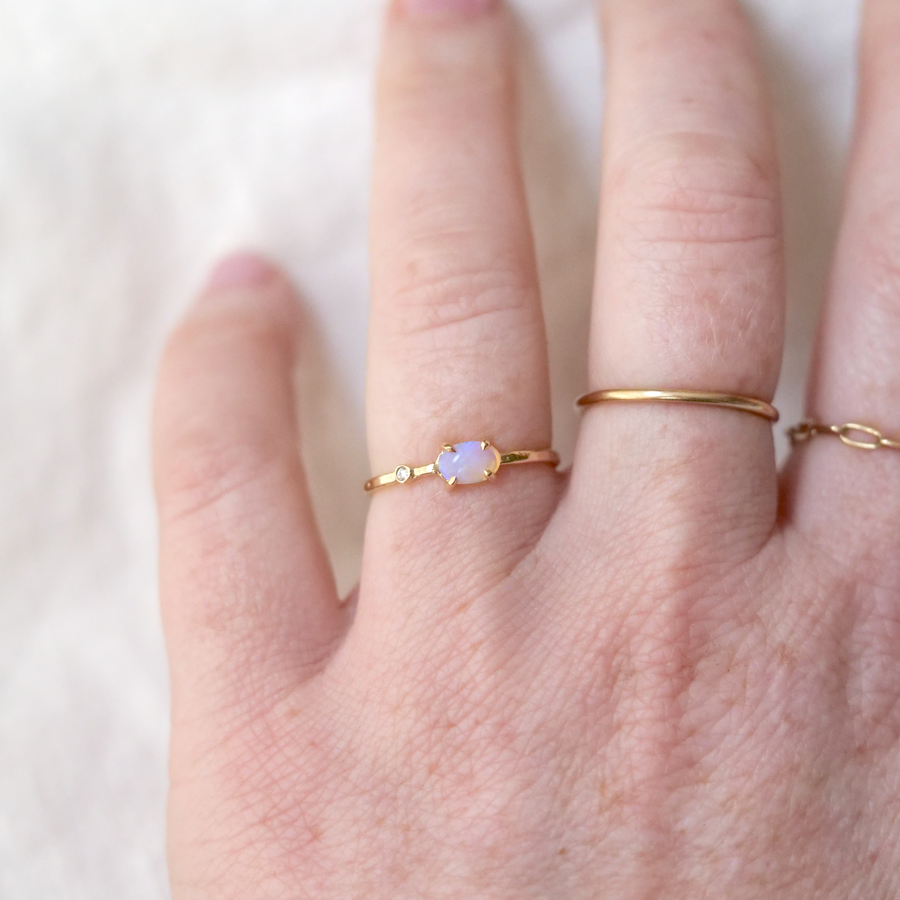 Opal and diamond set in 14k gold band.