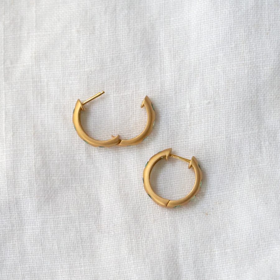 Gorgeous chunky 14k yellow gold clicker hoops with 8 emeralds per earring. Dimensions: 17.5mm x 4.8mm. Sold as a pair. 