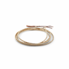 5 of 11: The Neso design beautifully highlights the continuity between the matte glass and gold beads that define this collection. Can be worn as a necklace or bracelet, and each piece is uniquely patterned so that no two are identical.
