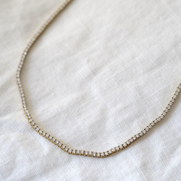 Bright white diamonds and 14k yellow gold Tennis necklace with an adjustable clasp