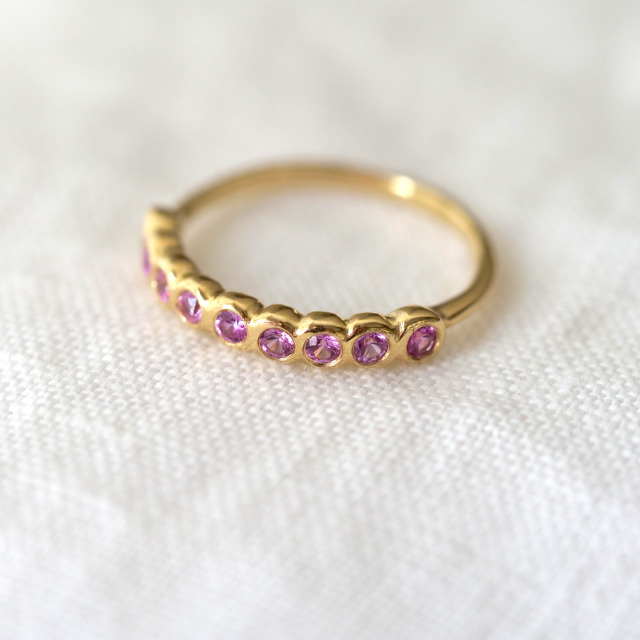 Pink Sapphires set in 18k yellow gold -- the stones has a pink hue with so much personality. Perfect for stacking or an unconventional wedding band